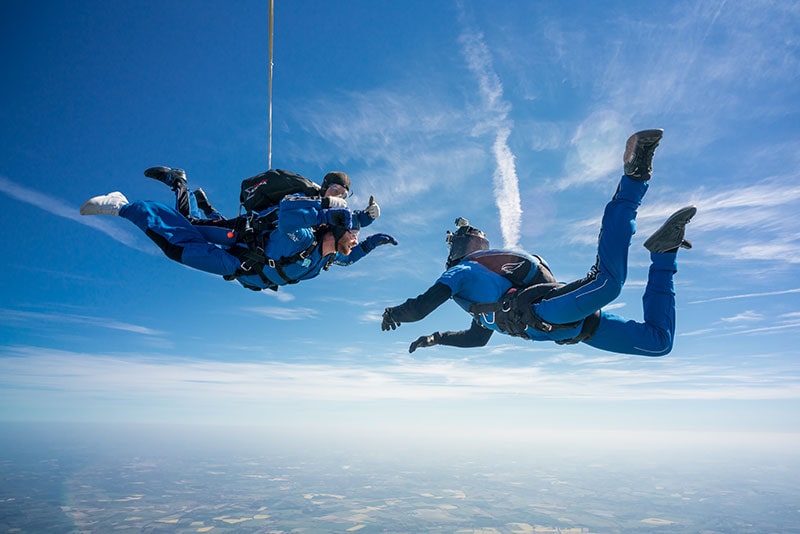Two people skydiving.